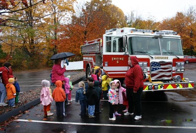 Children from the Children's Learning Center tour the fire engine.